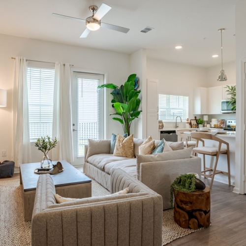 Spread Out and Unwind in Your Sprawling Living Room Living Room with Hardwood Vinyl Plank and Upscale Furniture